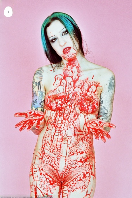 Tattooed girl Jen Vixen covers her naked body in fake blood at Halloween 14444760