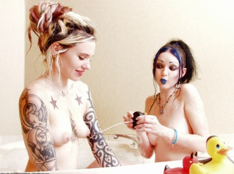 Alternative girls Voltaire & Scar 13 take a bath along with their rubber ducks 16521526