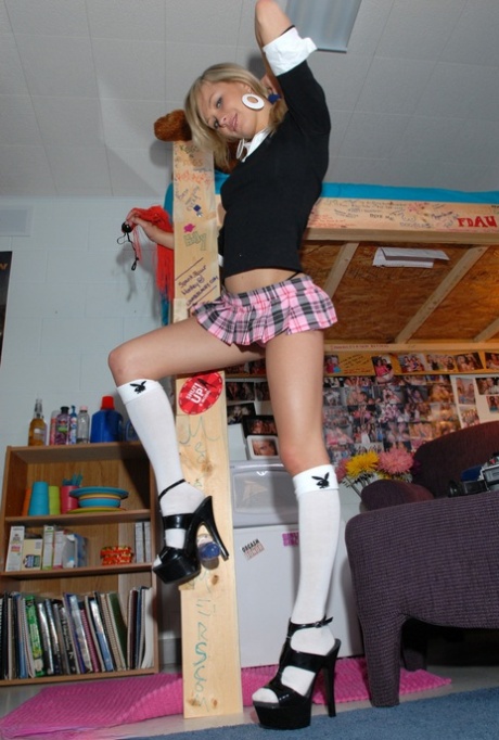 Sexy blonde teen Kasia in micro skirt and socks bending over to flash her ass 60121460