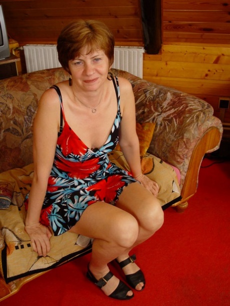 Mature lady with short red hair gets banged on an oversized armchair 13439482