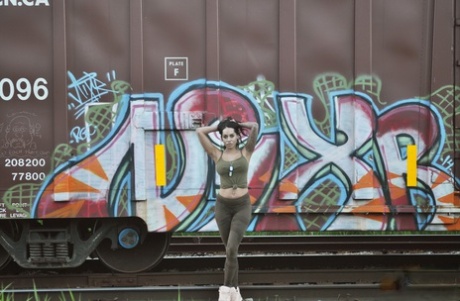 Latina teen Cindy Cupcakes flashes her ass in front of a boxcar 23001210