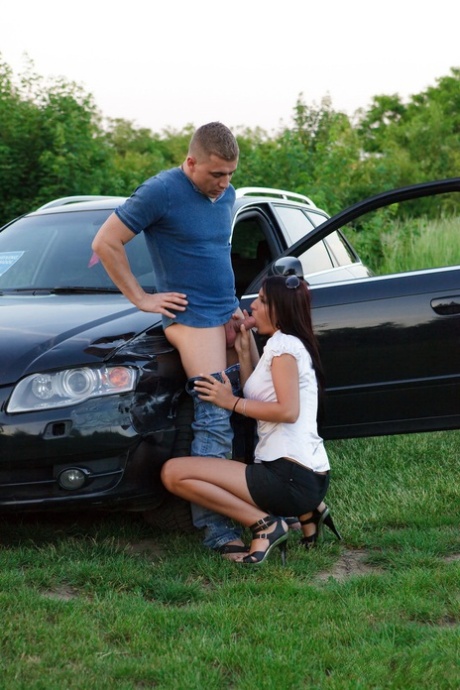 Horny couple have sex on and beside their car off of a gravel road 64734991