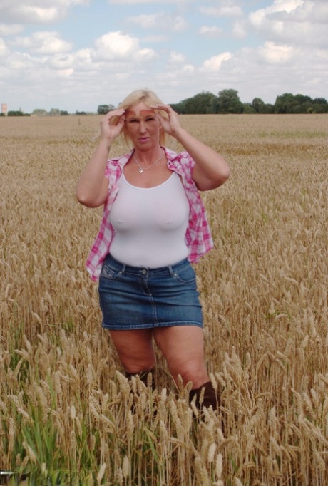 Chubby mature MILF Melody reveals great big tits & flashes hot ass in a field 37455627