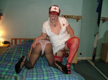 Mature nurse with red hair Valgasmic Exposed indulges in foreplay with a sissy 66770063