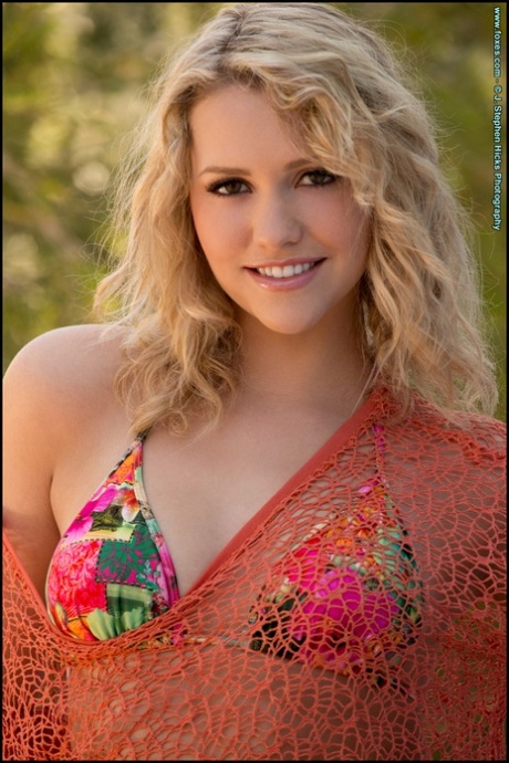 Beautiful blonde Mia Malkova goes topless on a sofa while in a backyard 92642447