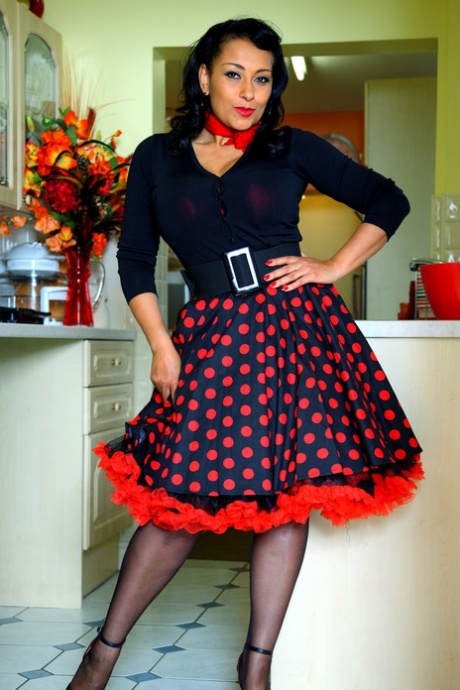 Mature lady Danica Collins exposes her big tits and butt in a ruffled skirt 77160573