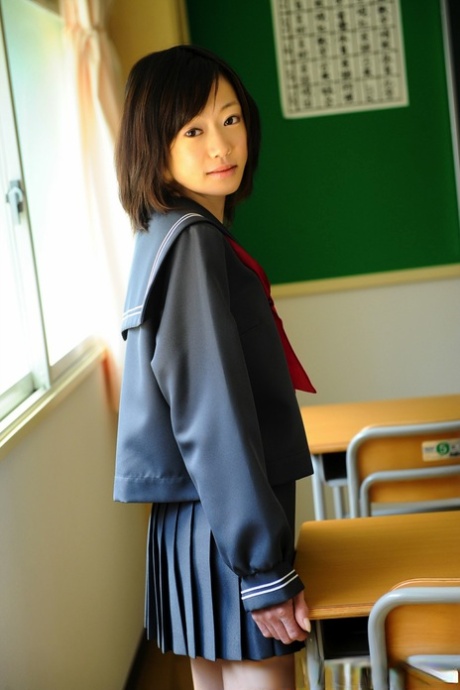 Barely legal Japanese student shows her bare knees in her school uniform 34110404