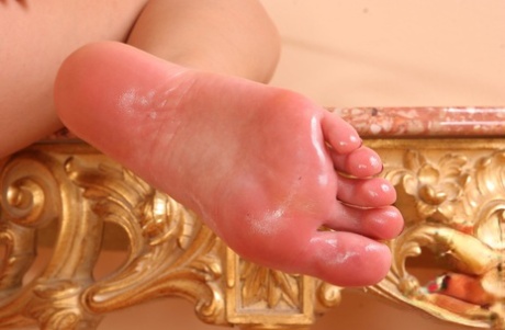 Caucasian female sports oily feet while fingering her vagina 18144899
