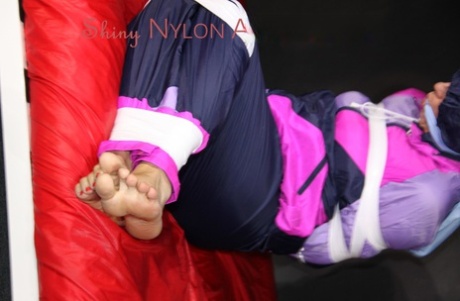 White girl is left tied up and gagged in nylon rainwear 73746179