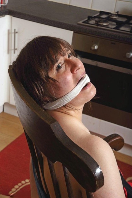 Caucasian lady is cleave gagged while tied up in the nude & while clothed too 90631947