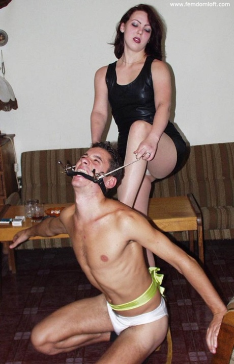 Dominant redhead subjects her male slave to being a footstool and ashtray 11319144