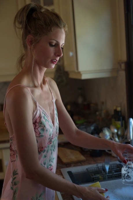 Blonde glamour model Rebecca Leah soaps up her naked body at the kitchen sink 62834140
