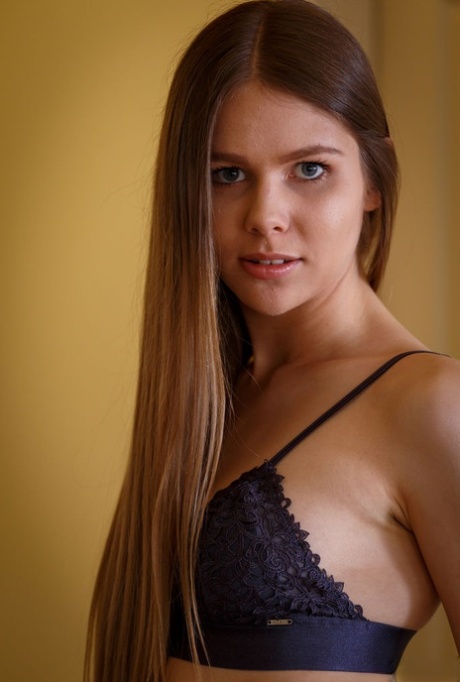 Beautiful teen Evelinaa plays with her hair while showing her shaved pussy 67980980