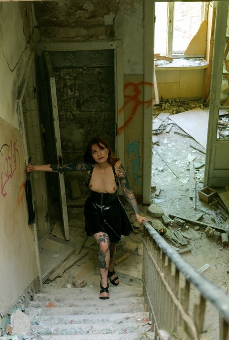 Tattooed redhead Cherr plays with her horny pussy at a derelict building 85066824