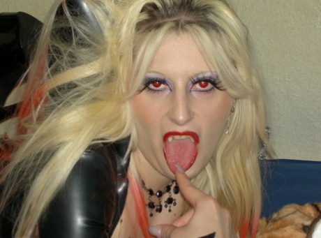 Blonde chick Avengelique sticks out her tongue while dressed in vampire attire 31498561