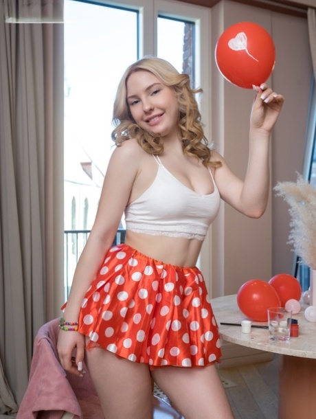 Charming blonde teen Lisbet strips naked while holding balloons 25313815