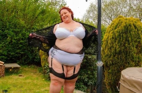 Morbidly obese older redhead dildos her snatch in a garter belt and nylons 47256393