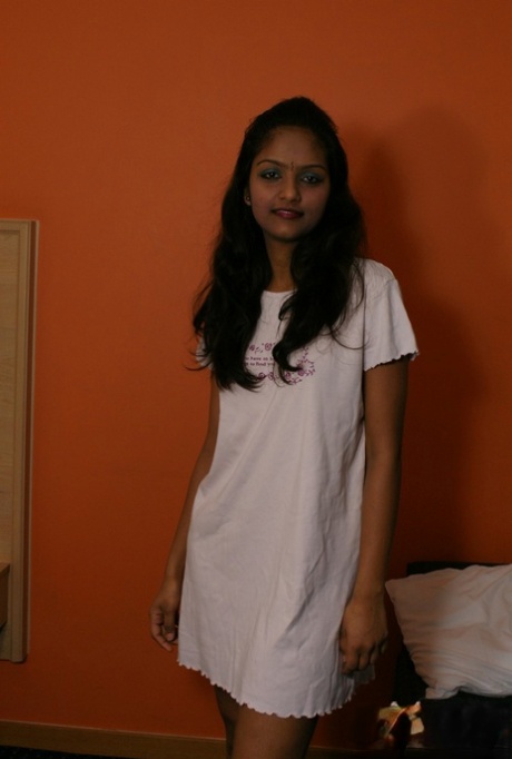 Indian female Divya lifts up a white dress to expose her vagina 26404498