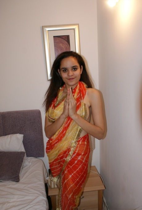 Indian solo girl releases her natural tits from her clothing on a bed 33612684