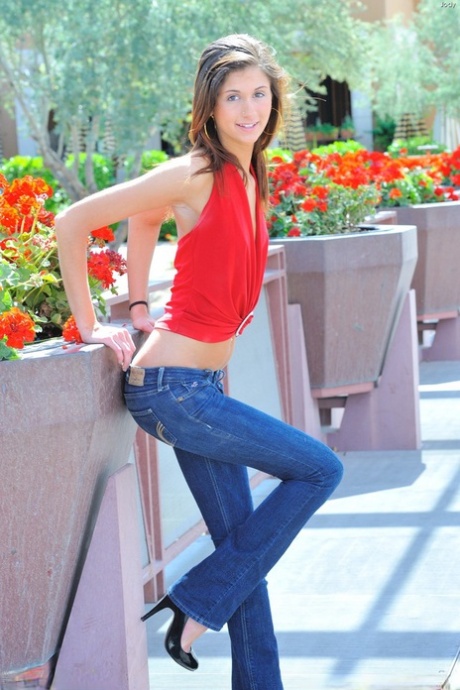 Thin girl in blue jeans undressing to model barefoot and naked in public 24542938
