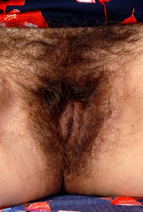 Old big breasted granny takes off her skirt and shows off her old hairy muff. 23802034