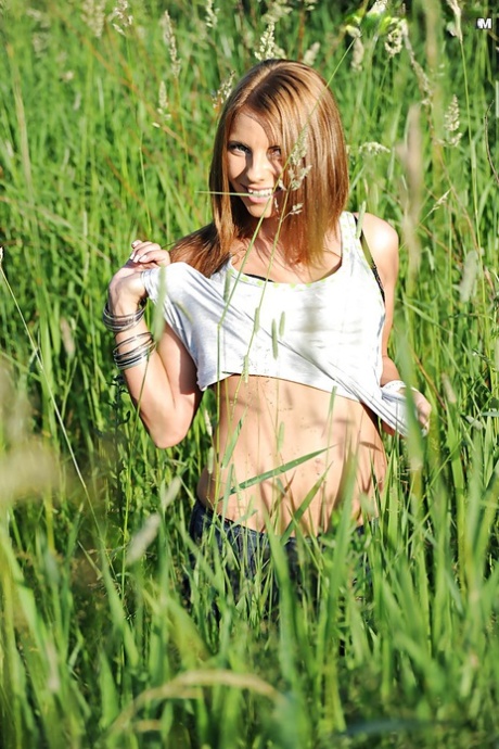 Loveable babe with petite tits stripping off her clothes outdoor 25452314